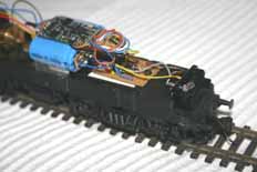 Home made circuit board for DCC installation on BR212 model showing capacitor power pack and Zimo MX64 decoder